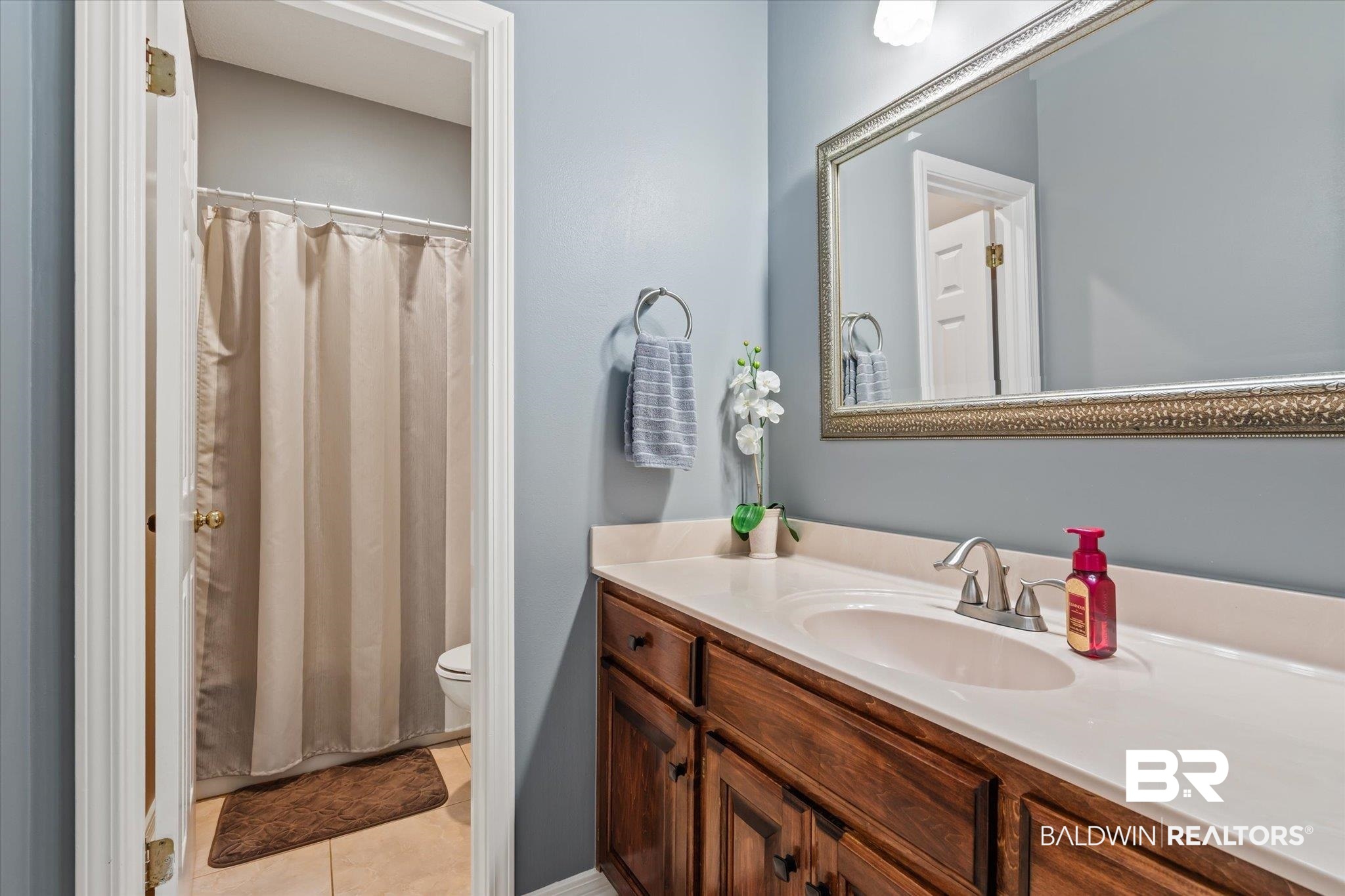 7360 Bridgewood Court Mobile, AL 36695 - Photo 18 of 30 Bathroom featuring vanity, toilet, and tile patterned floors