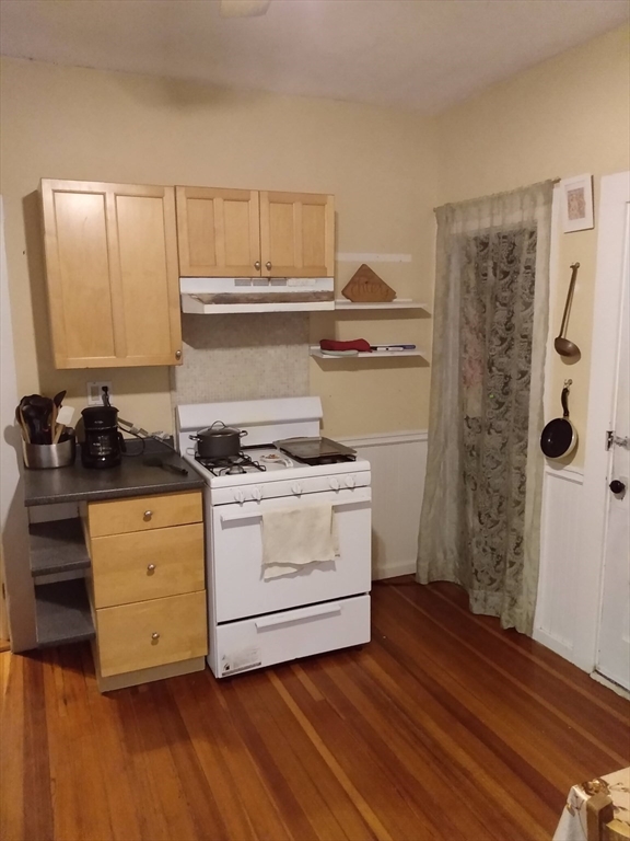 192 Federal Avenue, Unit B Quincy, MA 02169 - Photo 12 of 17 a kitchen with a stove and wooden floor