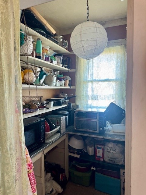 192 Federal Avenue, Unit B Quincy, MA 02169 - Photo 13 of 17 a kitchen with stainless steel appliances a stove and a bookshelf
