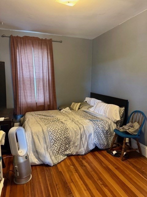 192 Federal Avenue, Unit B Quincy, MA 02169 - Photo 16 of 17 a bedroom with a bed and a chair