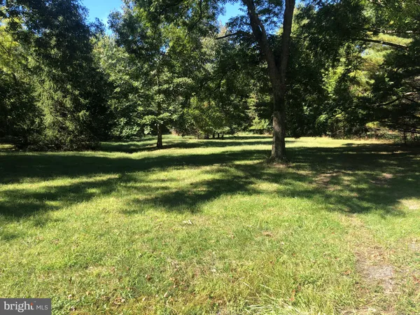 a view of a golf course with a lake