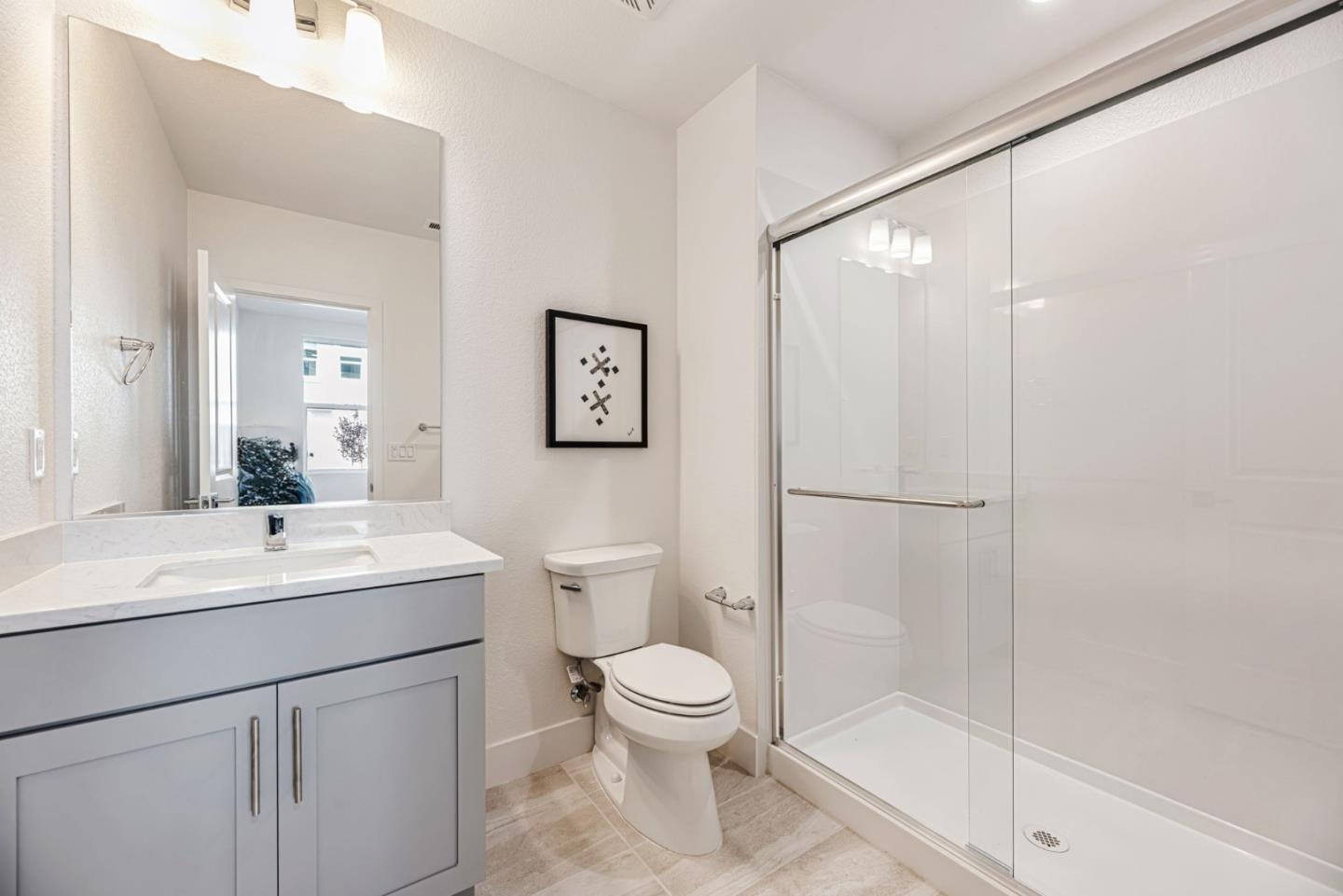 5005 Seashell Terrace San Ramon, CA 94583 - Photo 15 of 19 a bathroom with a toilet a sink and a mirror