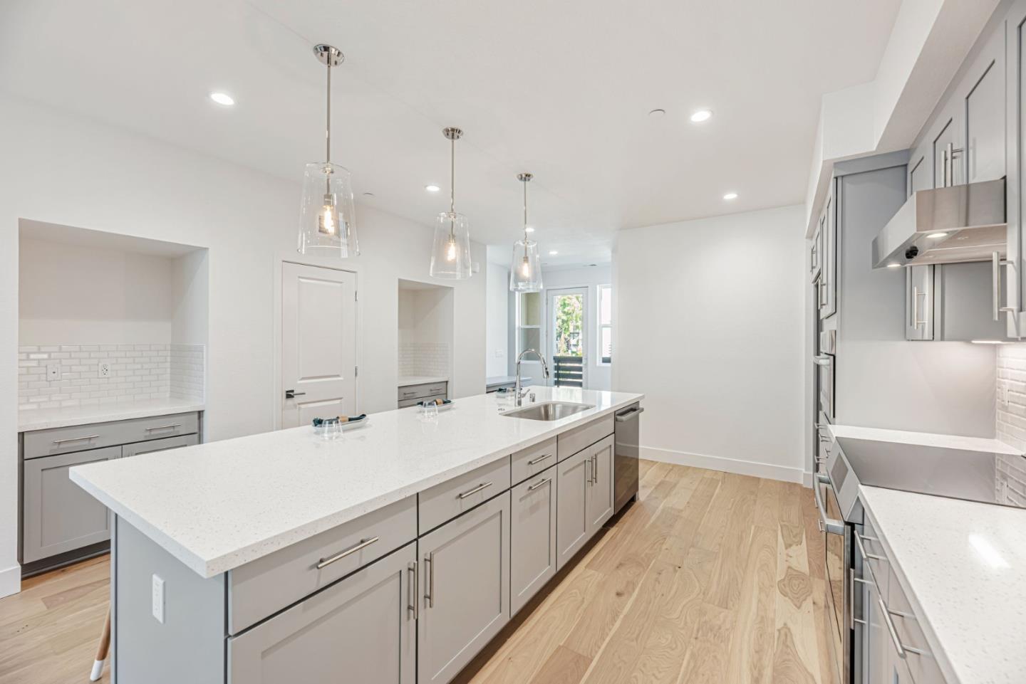 5005 Seashell Terrace San Ramon, CA 94583 - Photo 5 of 19 a large white kitchen with a lot of counter space