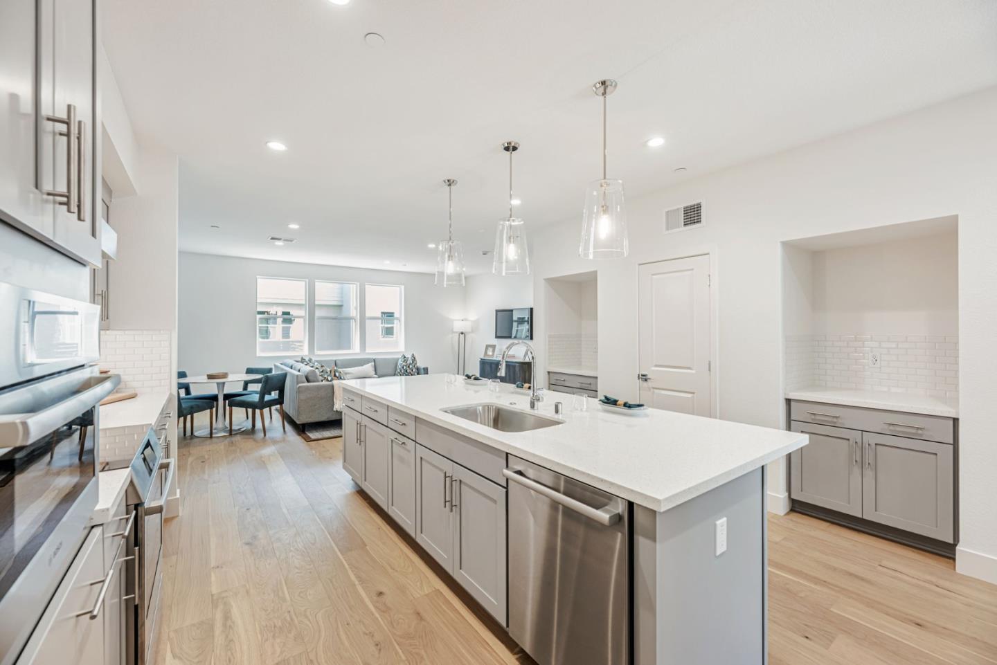 5005 Seashell Terrace San Ramon, CA 94583 - Photo 6 of 19 a kitchen with a sink stove and wooden floor
