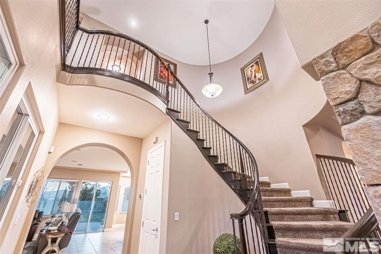 2610 Fury Court Reno, NV 89521 - Photo 13 of 25 a view of staircase with railing and a chandelier