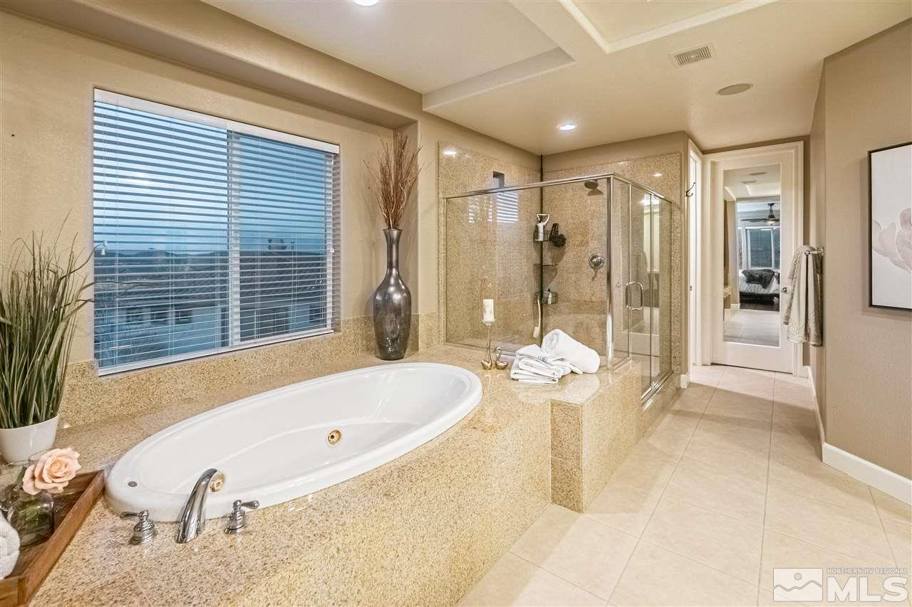 2610 Fury Court Reno, NV 89521 - Photo 16 of 25 a bathroom with a tub and a shower
