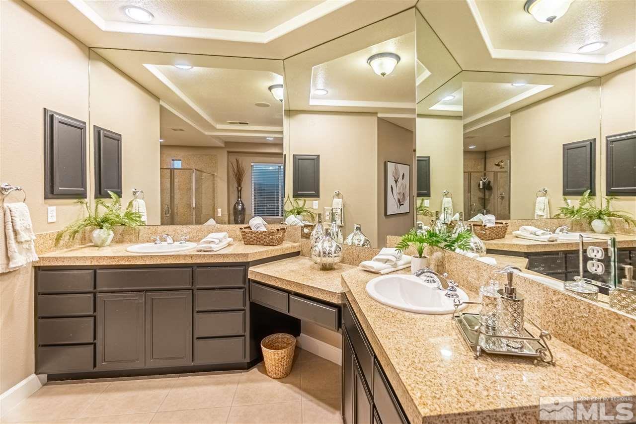 2610 Fury Court Reno, NV 89521 - Photo 17 of 25 a bathroom with a granite countertop sink mirror and