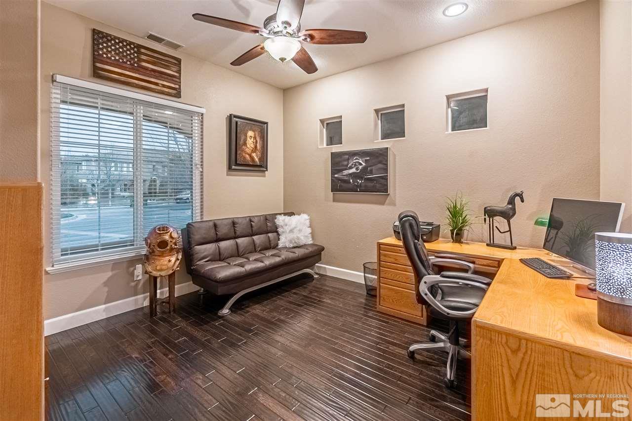 2610 Fury Court Reno, NV 89521 - Photo 21 of 25 a living room with furniture a wooden floor and a window