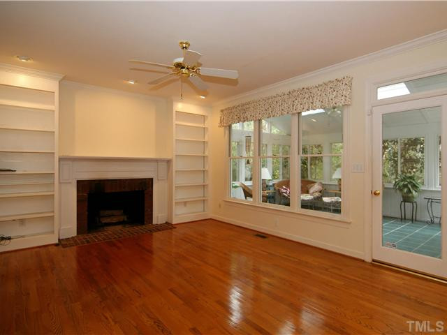 4829 Salem Ridge Road Holly Springs, NC 27540 - Photo 10 of 25 Built-in bookcases flank either side of the masonry fireplace. Den/Family/Great Room