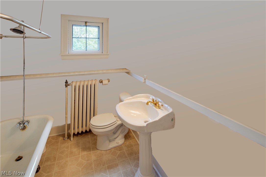 2977 Fontenay Road Cleveland, OH 44120 - Photo 26 of 32 3rd floor bathroom: shown here with white walls to help you see the potential. Currently has floral wall paper.