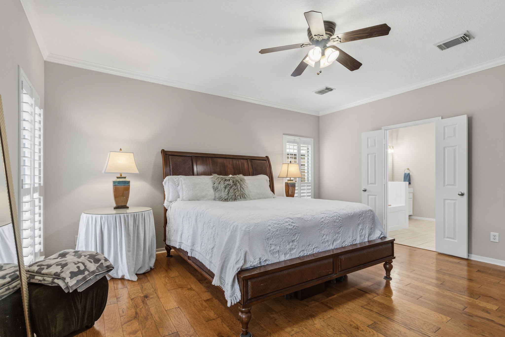 8419 Marchelle Lane Spring, TX 77379 - Photo 11 of 42 a bedroom with a bed and a chandelier