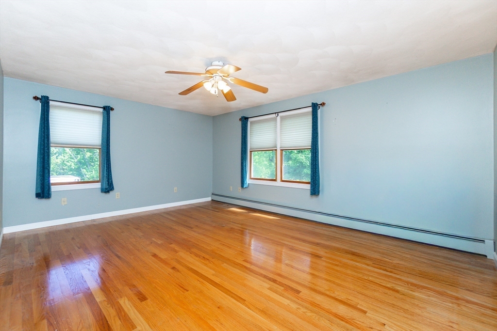 63 Bow Street Saugus, MA 01906 - Photo 22 of 42 wooden floor in an empty room with a window