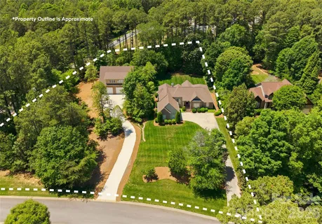 an aerial view of residential houses with yard