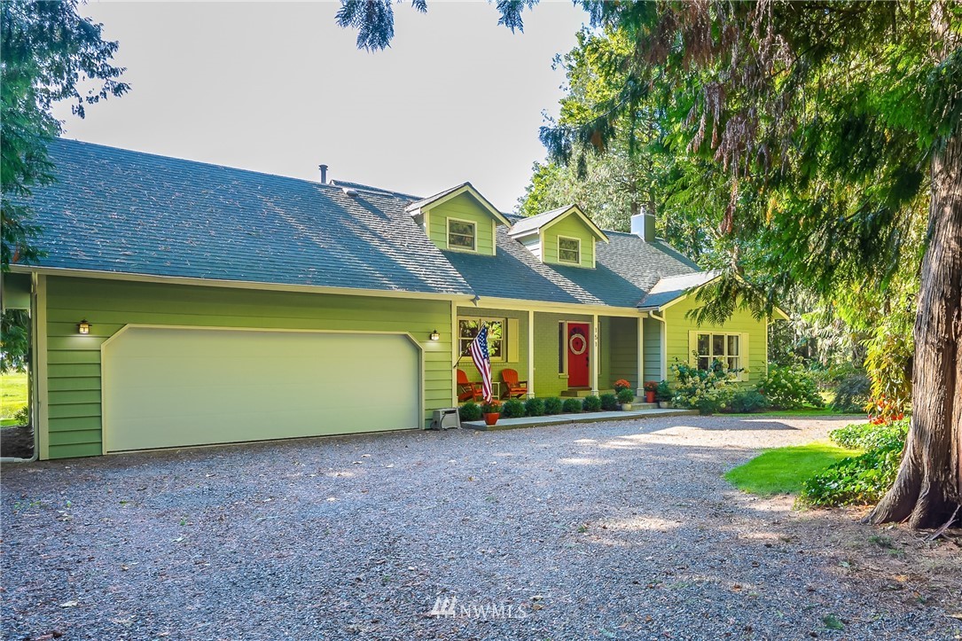 151 East Boundary Road Lynden, WA 98264 - Photo 22 of 24 a front view of a house with a garden and garage