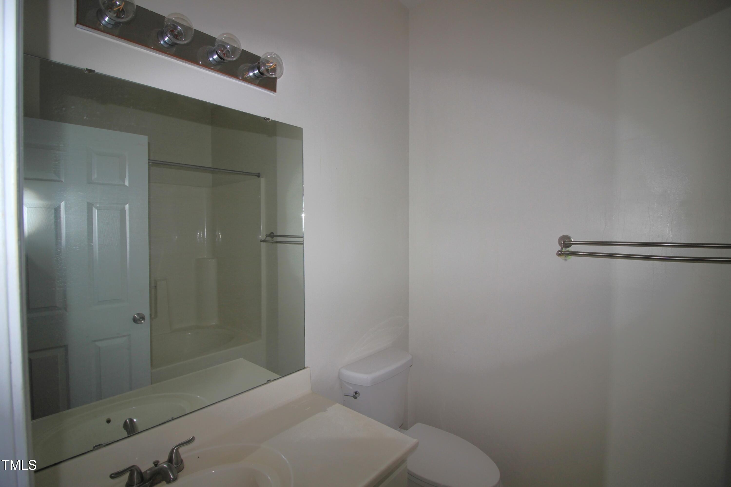 2201 Valley Haven Drive Raleigh, NC 27603 - Photo 11 of 16 a bathroom with a shower and toilet