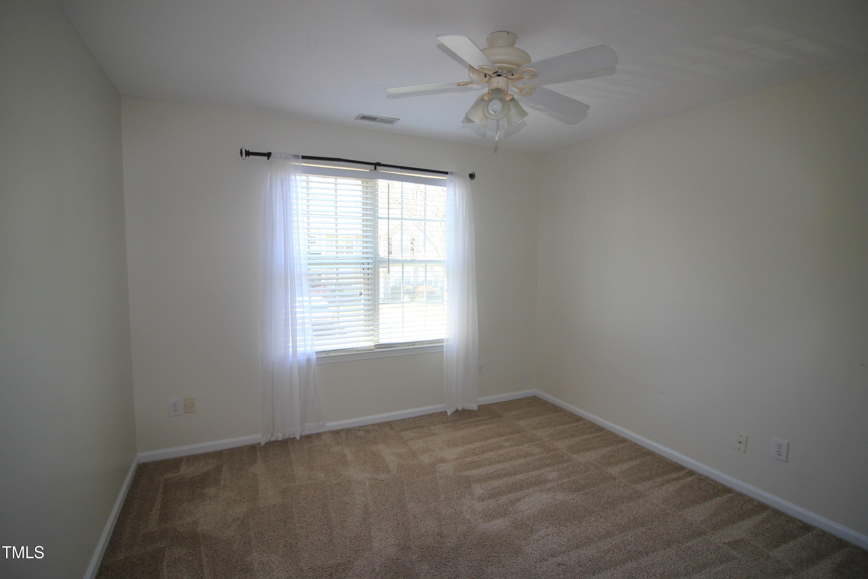 2201 Valley Haven Drive Raleigh, NC 27603 - Photo 12 of 16 an empty room with a window