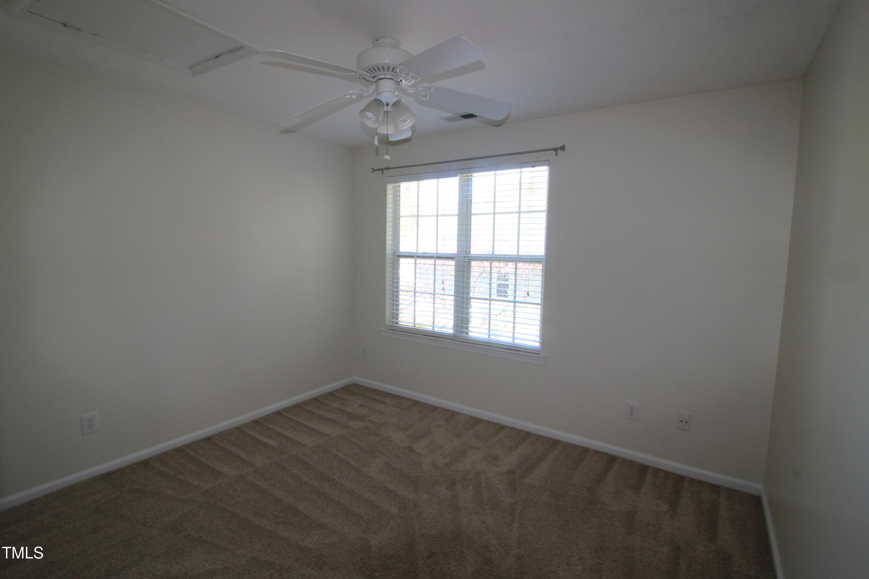 2201 Valley Haven Drive Raleigh, NC 27603 - Photo 14 of 16 an empty room with a window