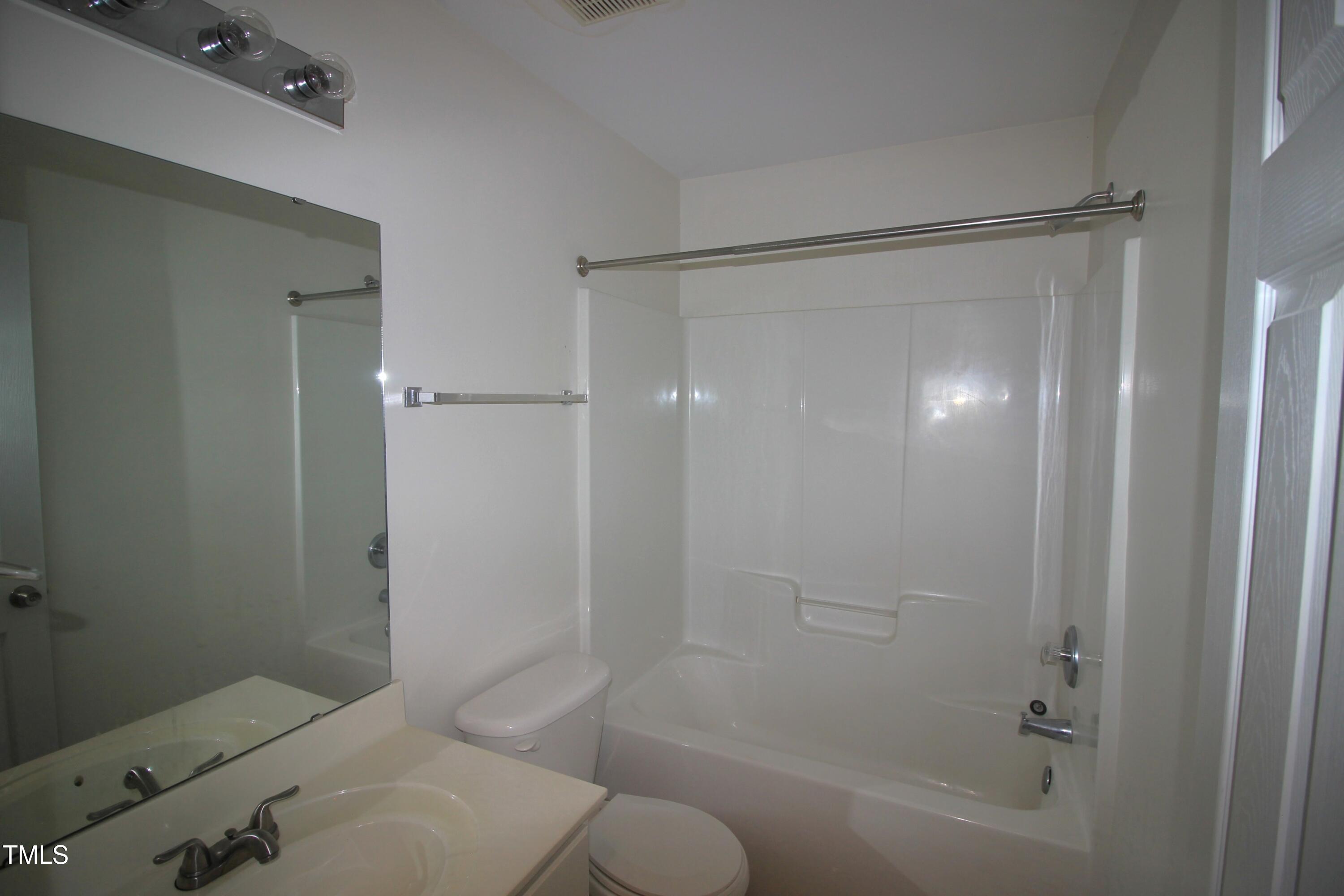 2201 Valley Haven Drive Raleigh, NC 27603 - Photo 16 of 16 a bathroom with a shower and a toilet