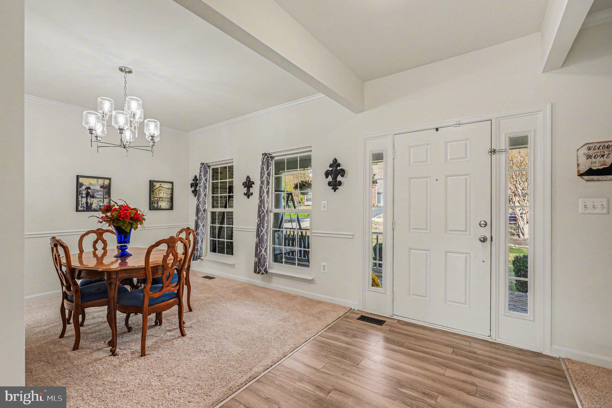 Welcoming entry with elegant dining.