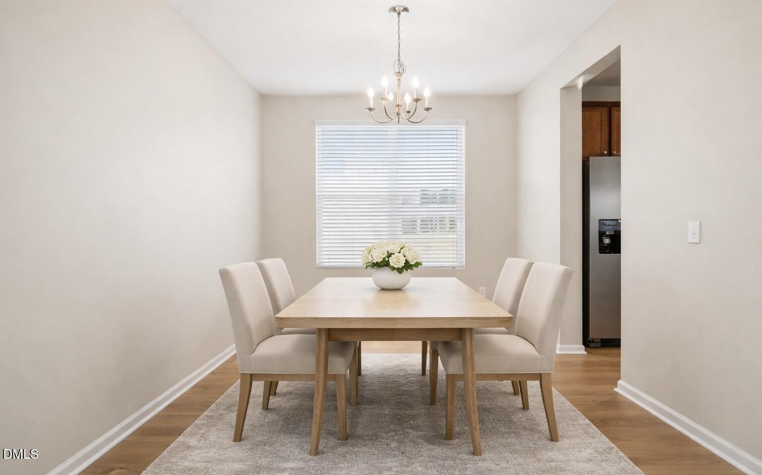 3905 Massey Pointe Court Raleigh, NC 27616 - Photo 4 of 12 a view of a dining room with furniture window and wooden floor