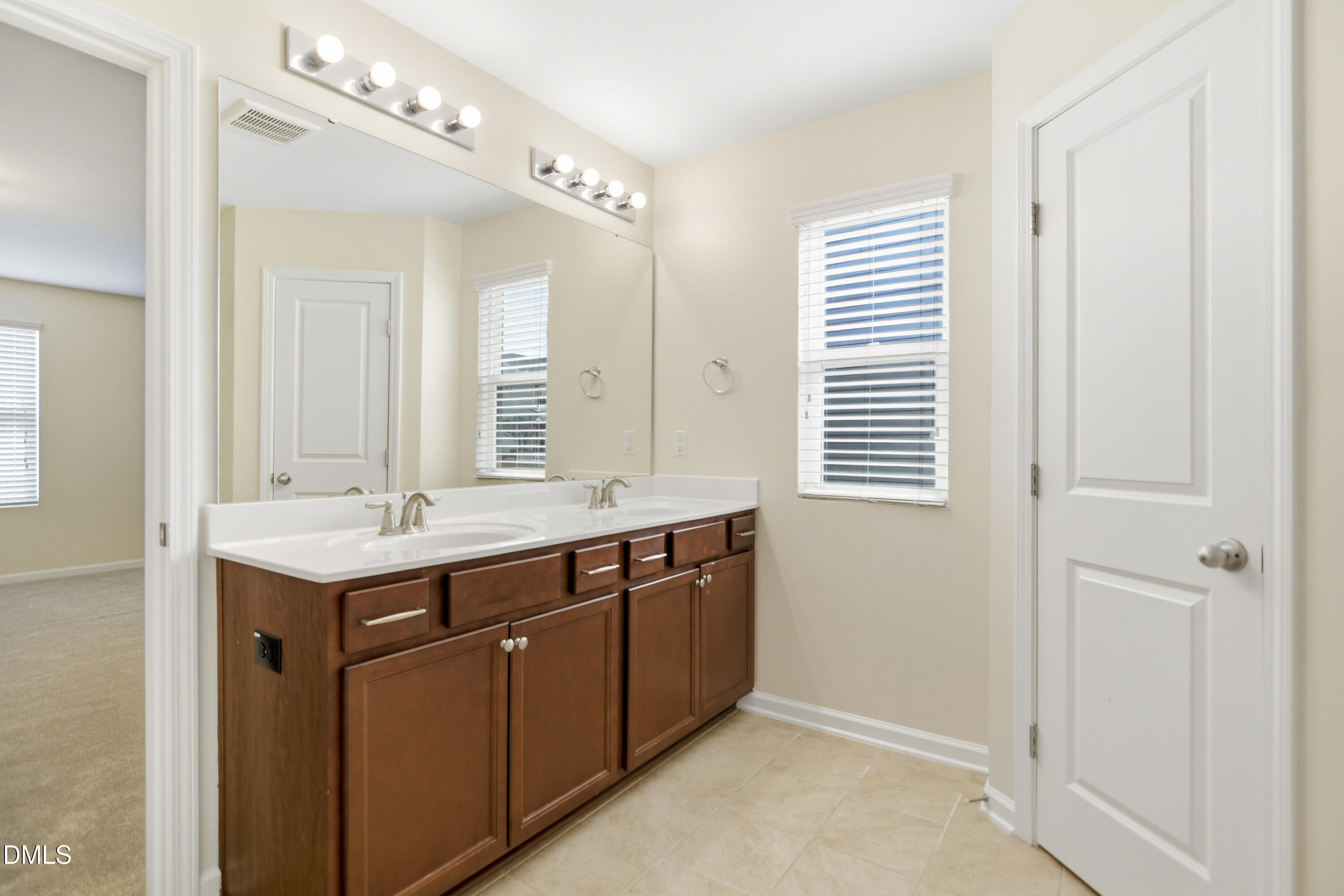 3905 Massey Pointe Court Raleigh, NC 27616 - Photo 7 of 12 a bathroom with a sink and a mirror