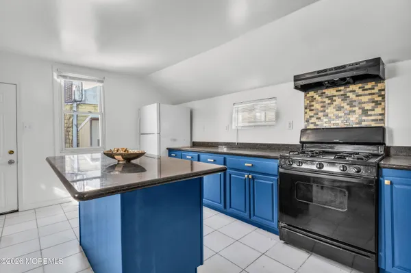 a kitchen with stainless steel appliances granite countertop a stove and a sink