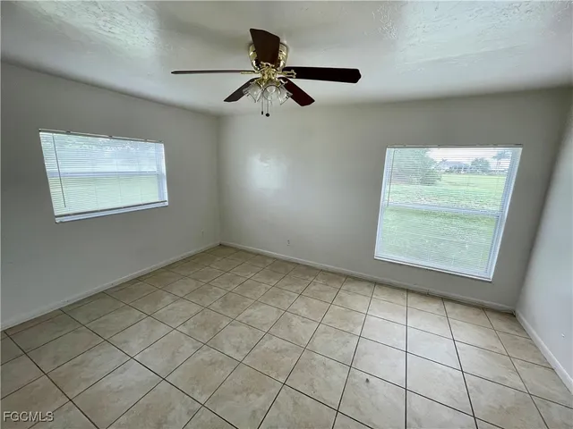 a view of an empty room and a window
