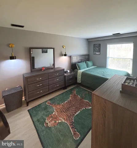 a bed room with a bed and a tv