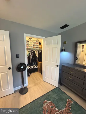 a view of a room with furniture and a window