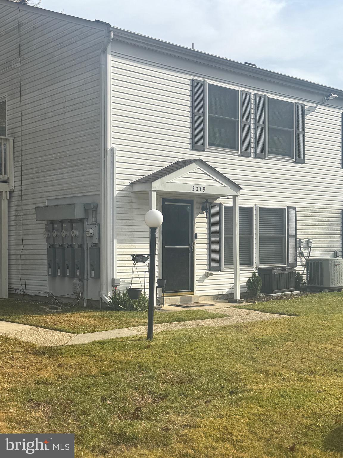 3079 Chester Grove Road, Unit 42E Upper Marlboro, MD 20774 - Photo 19 of 20 a front view of a house with a yard