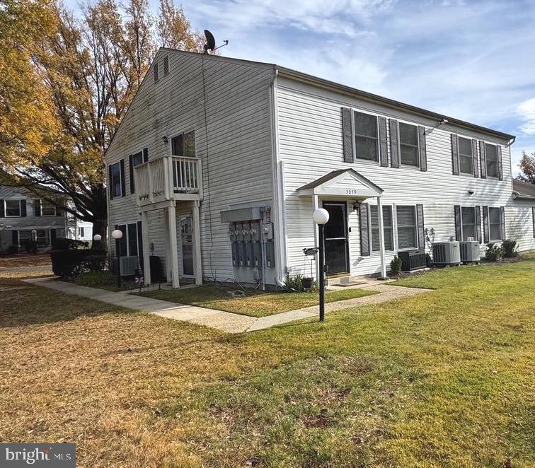 3079 Chester Grove Road, Unit 42E Upper Marlboro, MD 20774 - Photo 2 of 20 a front view of a house with a yard balcony