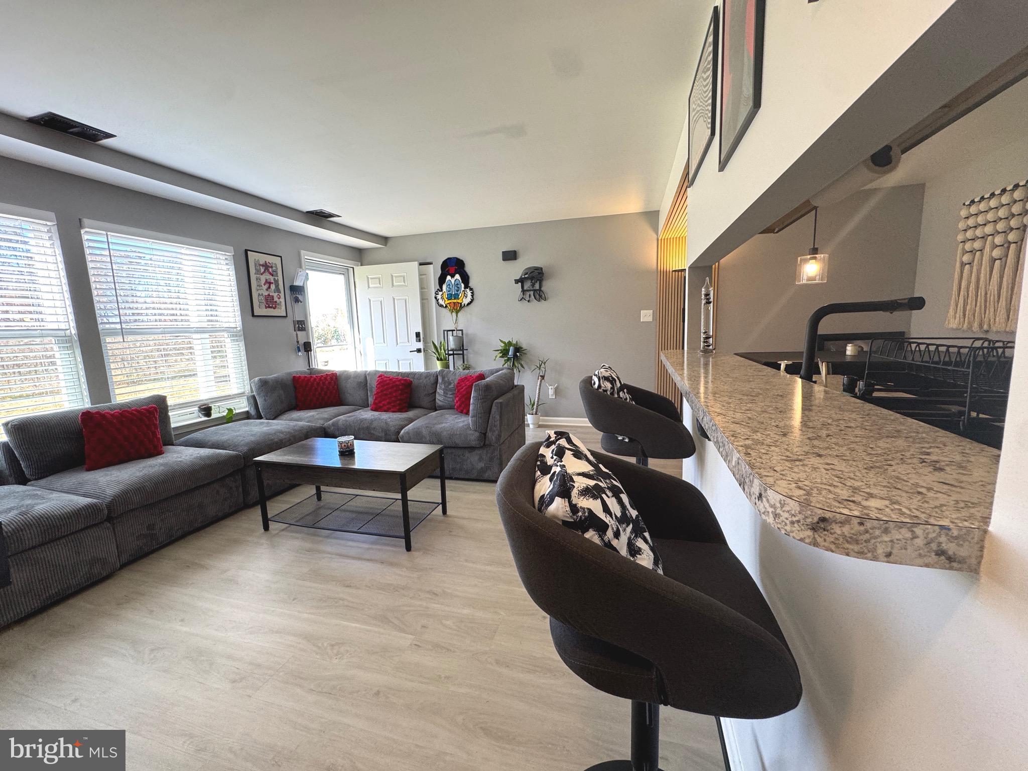 3079 Chester Grove Road, Unit 42E Upper Marlboro, MD 20774 - Photo 5 of 20 a living room with furniture and a large window