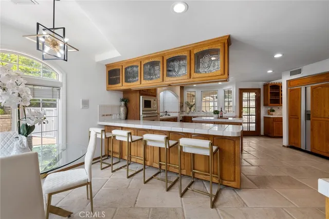 a kitchen with granite countertop a sink and a window