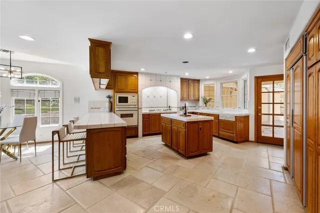 a bedroom with a large bed and a couch