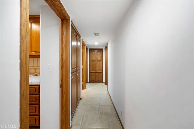 a view of a dining room with furniture a chandelier and wooden floor