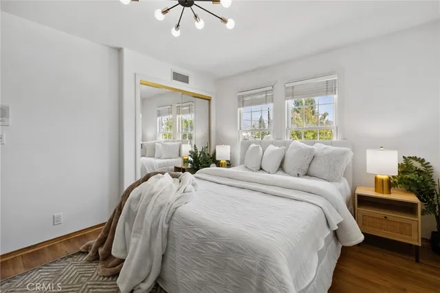 a bed room with a bed and a window