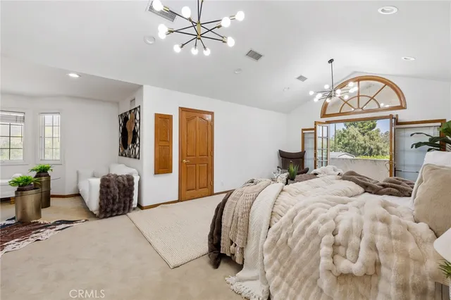 a backyard of a house with barbeque oven fire pit table and chairs