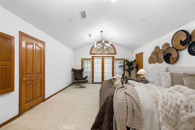 a view of a pathway with a wrought fence