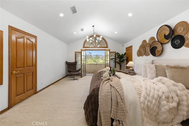 a view of swimming pool with tree in front of it
