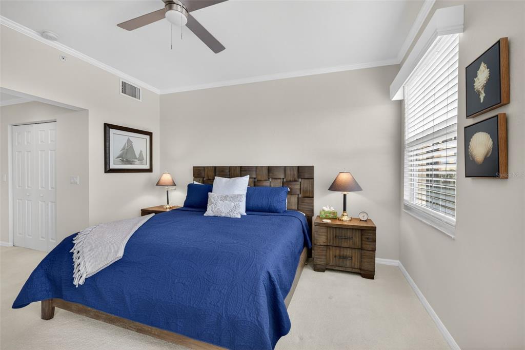 2060 Matecumbe Key Road, Unit 2506 Punta Gorda, FL 33955 - Photo 16 of 38 a bedroom with a bed and cabinets