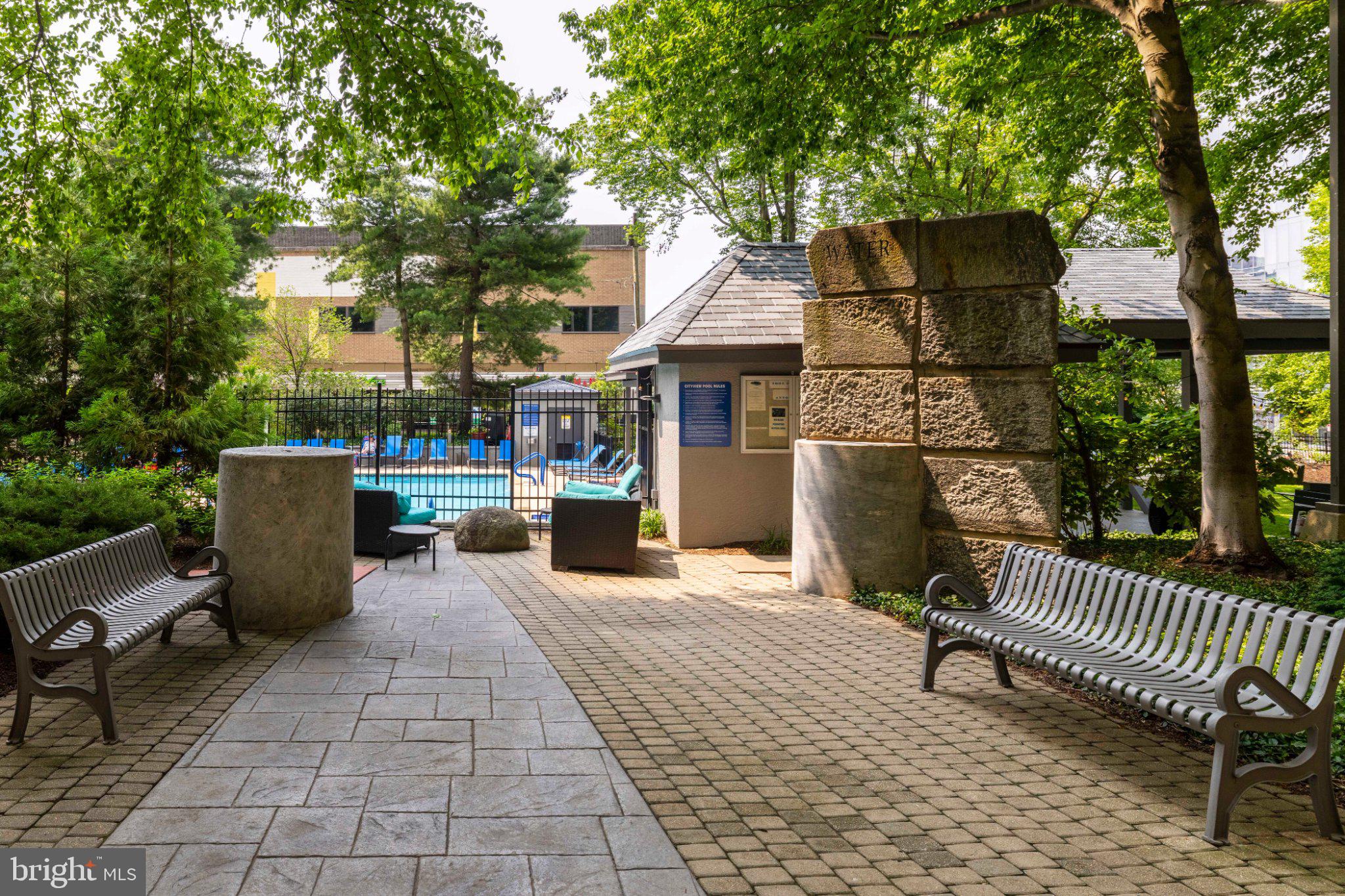 2001 Hamilton Street, Unit 1119 Philadelphia, PA 19130 - Photo 34 of 44 Tranquil pathway to a refreshing pool.