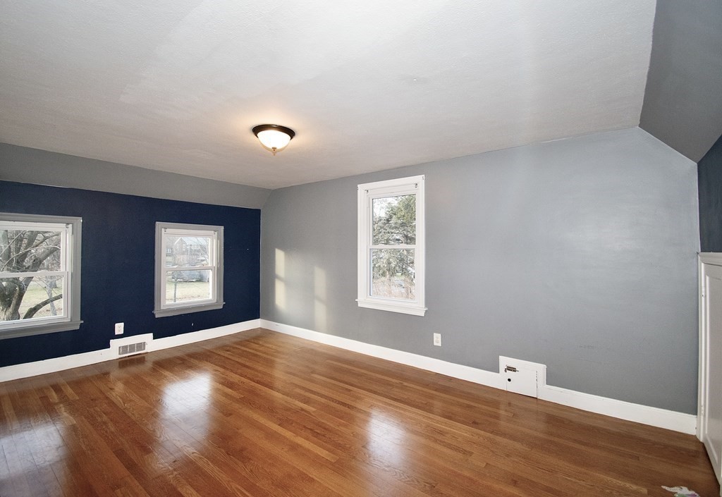1617 Plumtree Road Springfield, MA 01119 - Photo 12 of 25 a view of an empty room with window and wooden floor