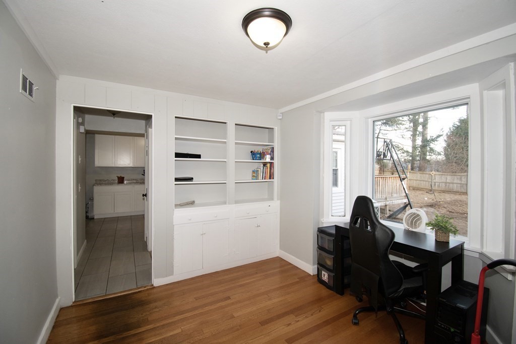 1617 Plumtree Road Springfield, MA 01119 - Photo 14 of 25 a view of a workspace with furniture and a window