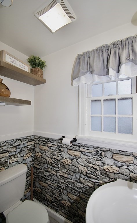 1617 Plumtree Road Springfield, MA 01119 - Photo 16 of 25 a bathroom with a sink a toilet and a mirror