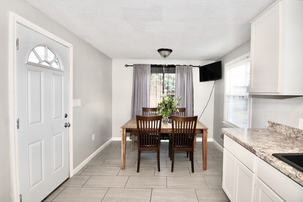 1617 Plumtree Road Springfield, MA 01119 - Photo 6 of 25 a view of a dining room with furniture and a window