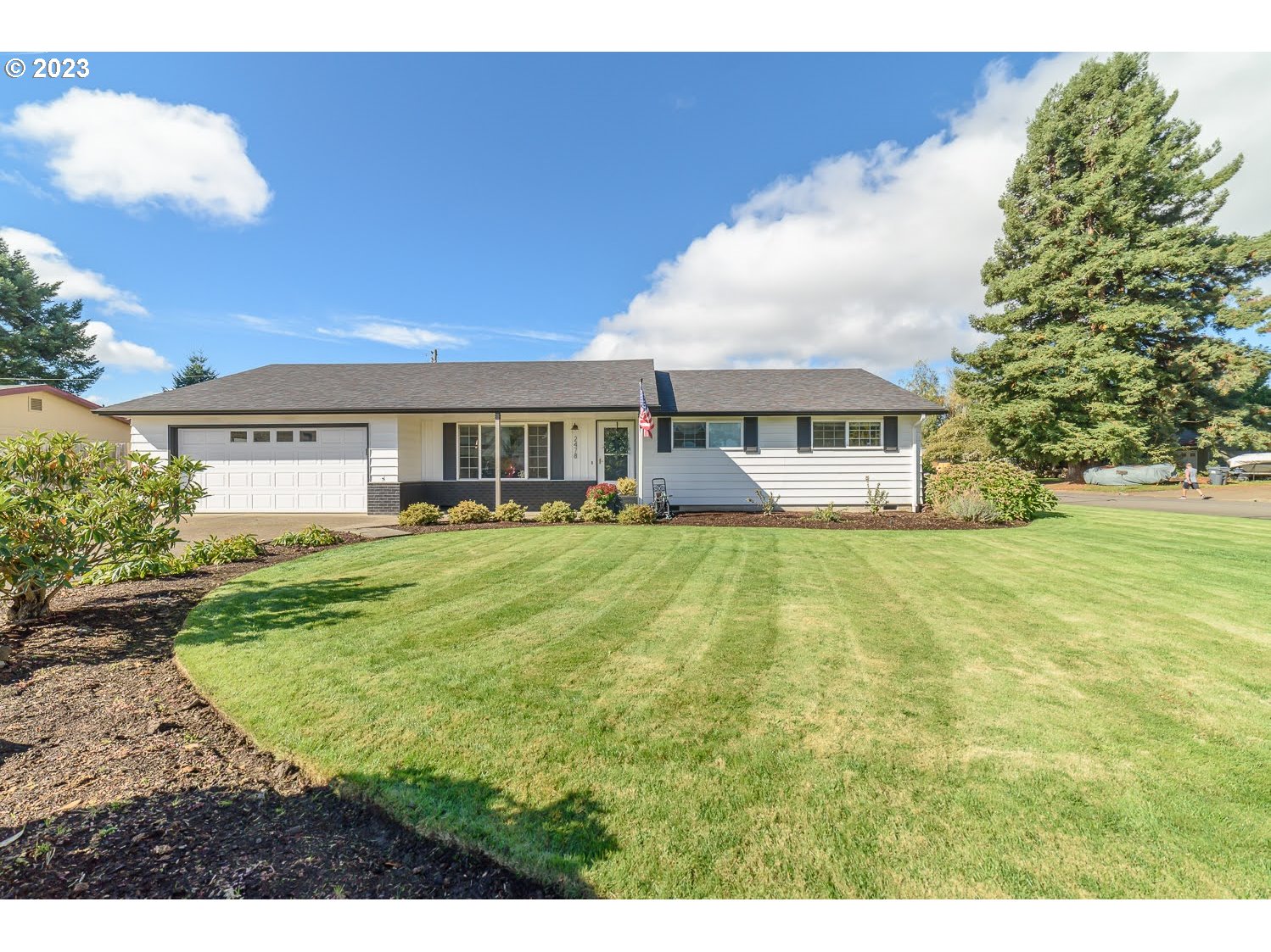 2478 15th Street Springfield, OR 97477 - Photo 1 of 29 a view of house with yard and trees in the background
