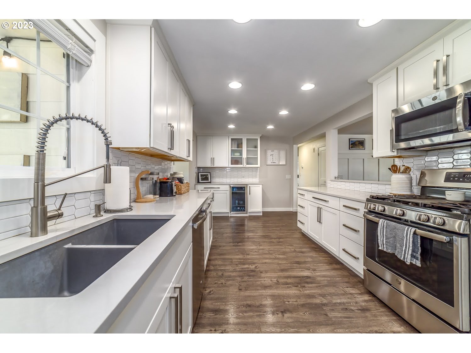 2478 15th Street Springfield, OR 97477 - Photo 11 of 29 a kitchen with stainless steel appliances granite countertop a sink stove and refrigerator