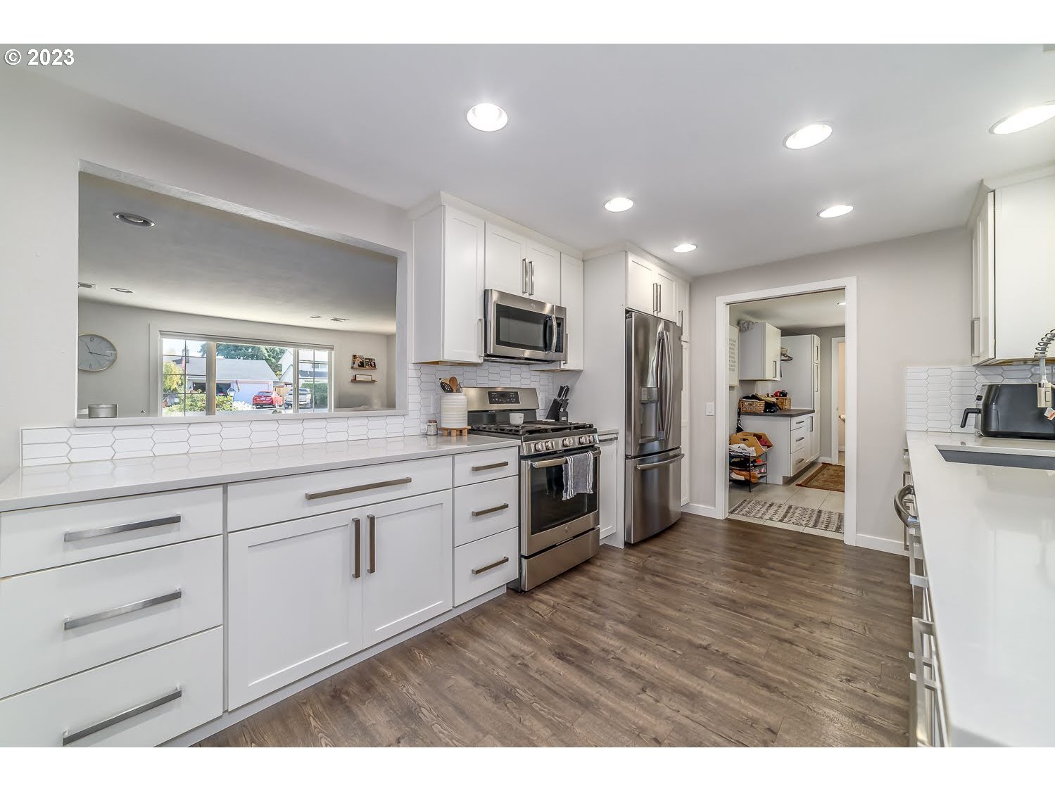 2478 15th Street Springfield, OR 97477 - Photo 8 of 29 a kitchen with granite countertop stainless steel appliances and cabinets