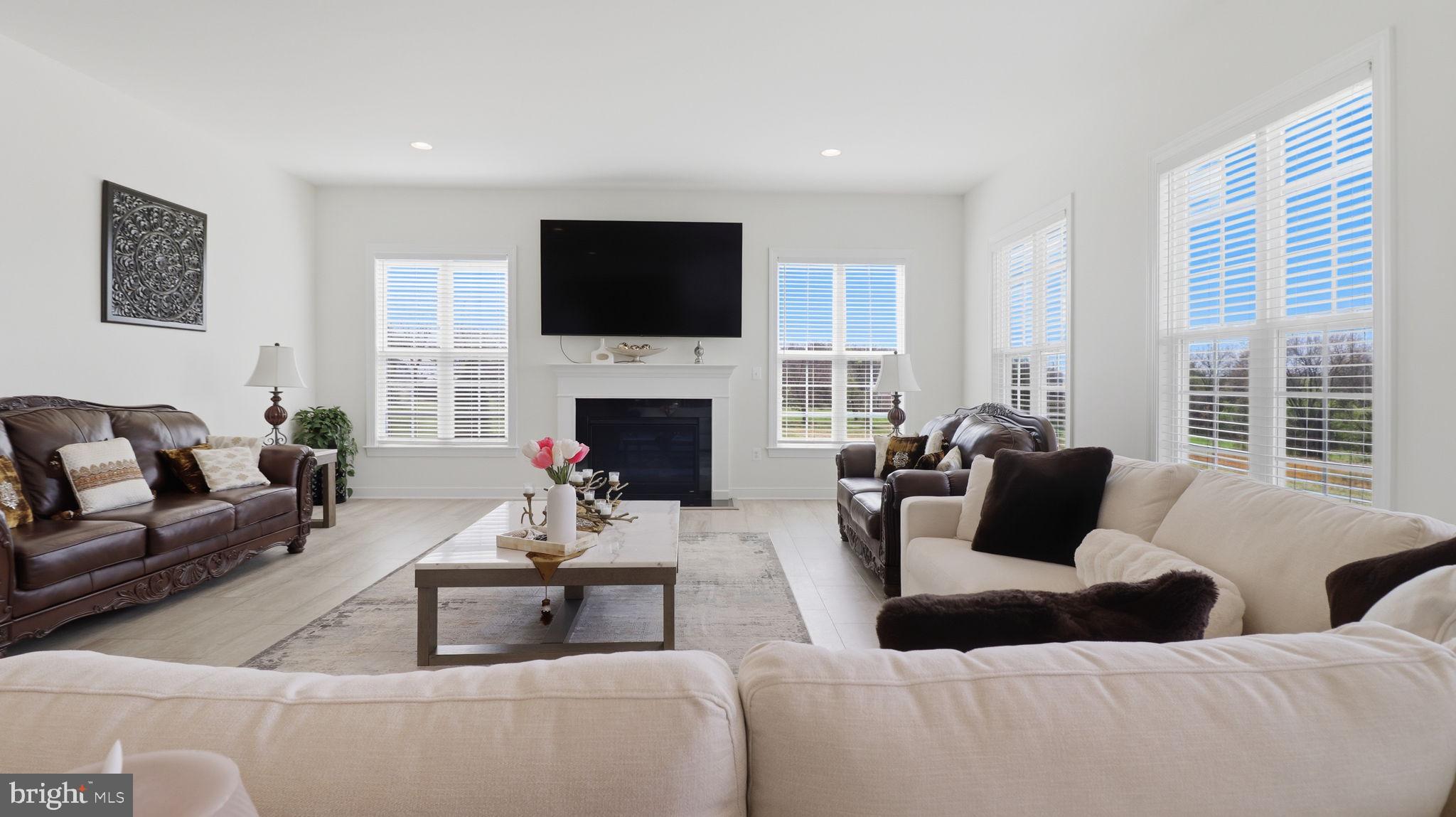 11502 Aden Road Nokesville, VA 20181 - Photo 42 of 106 a living room with furniture fireplace and flat screen tv