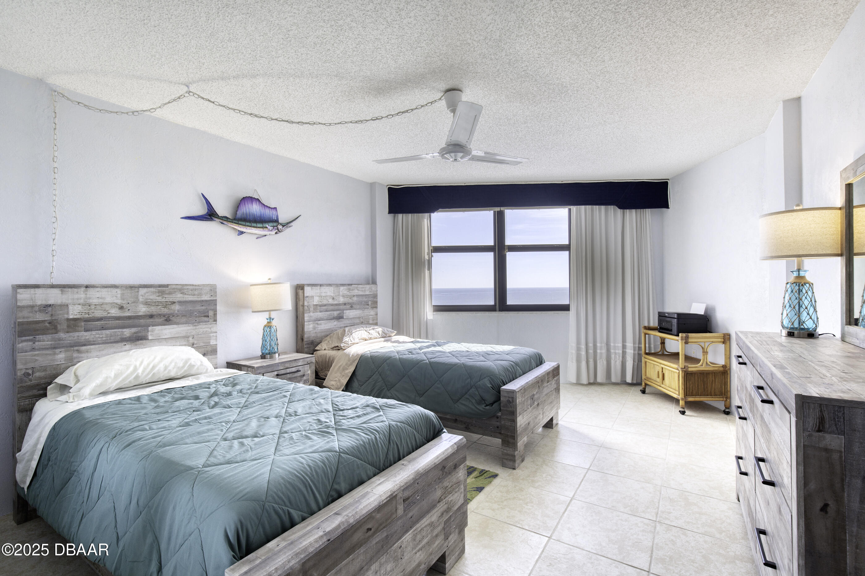 1415 Ocean Shore Boulevard, Unit 1010 Ormond Beach, FL 32176 - Photo 22 of 52 a bedroom with two beds and a window